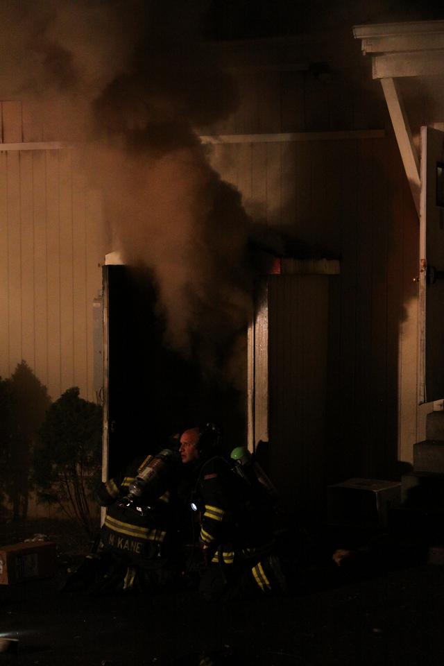 Mutual aid Katonah Old Deer Park Fire. Lt. Kane and Chief Liburdi making entry into the basement